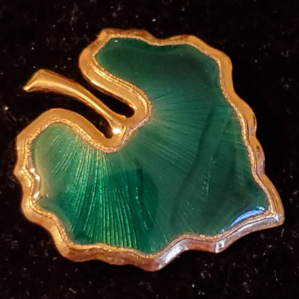Goldtone and green enamel leaf brooch
